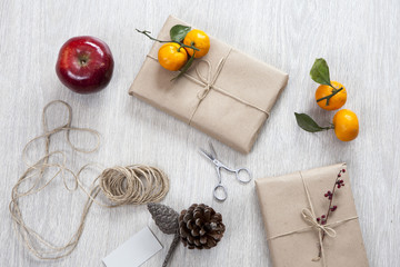 Various items for gift wrapping are on the table.