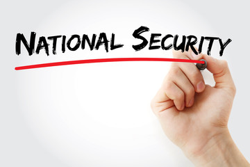 Hand writing National security with marker, concept background