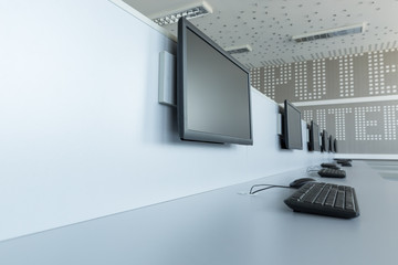 Workplace room with computers in row.