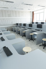 Workplace room with computers in row.