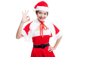 Asian Christmas Santa Claus girl show Ok sign.