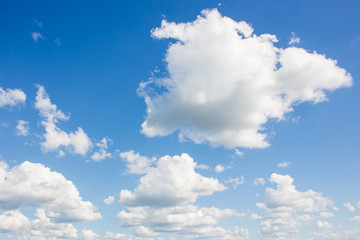 Naklejka na ściany i meble Small cloud group in clear sky background.