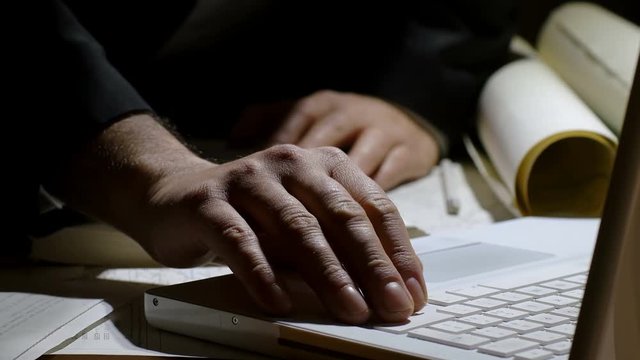 man working in his office with laptop computer 