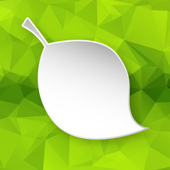 Paper leaf over geometric background