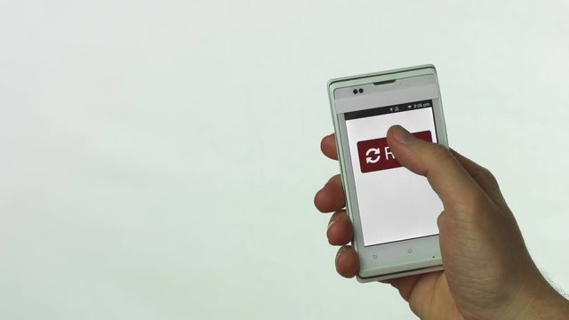Phone Reset button pressed on video, mobile phone concept video for starting over, restarting procedures, relationships, connections.