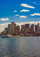 Fototapeta na wymiar Skyline of Boston and floating ship during the sunny day