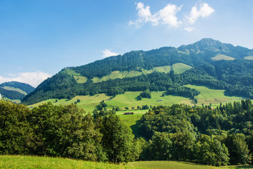 Chalets and Prealps mountains in Gruyere district in Fribourg Swiss