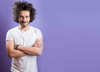 Obraz premium Beautiful caucasian man with funny hair over color background