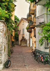 Narrow street with bicycles in Ascona of Ticino in Switzerland