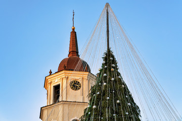 Christmas tree with decorations and Belfry on Cathedral Square Vilnius