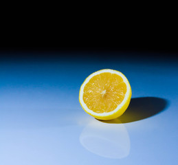 fresh lemon cut on glasses table