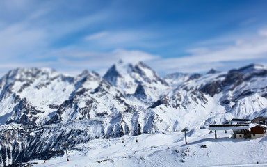 Fototapeta na wymiar Panorama of Mountain Range Landscape at Meribel in French Alps. Tilt Shift Effekt 