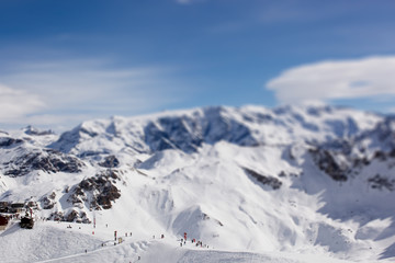 Fototapeta na wymiar Panorama of Mountain Range Landscape at Meribel in French Alps. Tilt Shift Effekt 