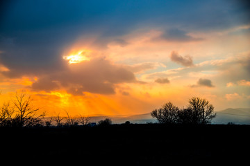 Fototapeta premium Dramatic clouds at the sunset