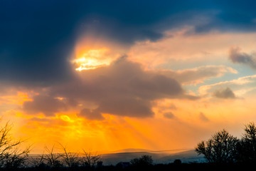 Fototapeta na wymiar Dramatic clouds at the sunset