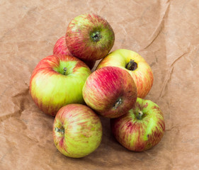 Group of fresh organic apples on a craft paper