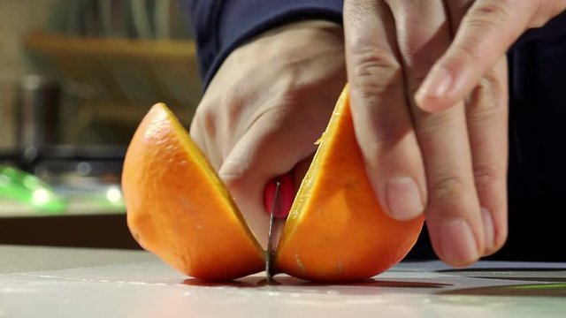 cutting oranges to make orange juice