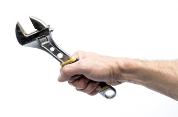 adjustable spanner in hand on a white background