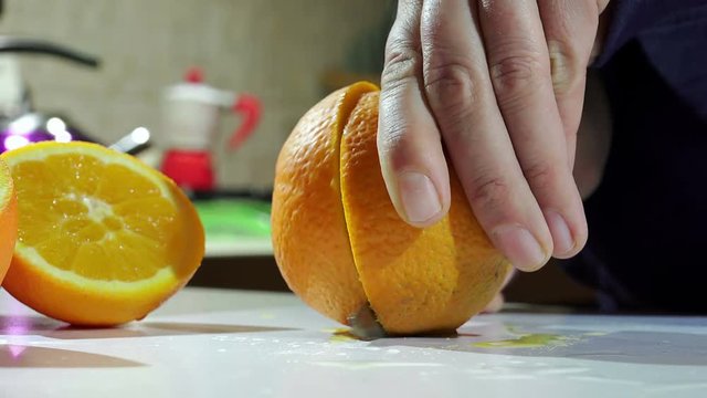 cutting fresh oranges to squeezing oranges and make orange juice