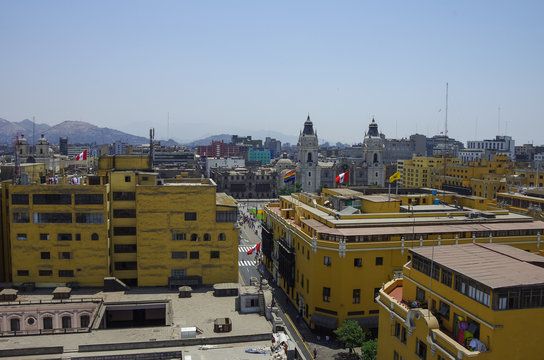 View to roofs of downtown  and Cathedral church on the main square Plaza de Armas in historic part of Lima city, from  Convento de Santo Domingo. Lima, Peru