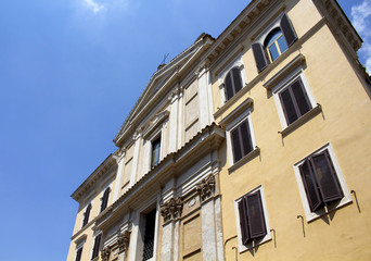 Fototapeta na wymiar Bottom view of traditional Italian building in Rome.