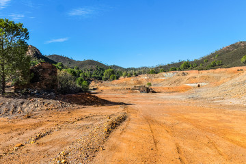 Fototapeta na wymiar Panoramic view of remains in antique exploitation of copper mine in village Sotiel Coronada in Huelva, Andalusia, Spain