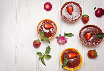 Strawberry fruit jelly with fresh berries and mint.  Dessert of jelly and berries. Top view