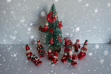 Fototapeta na wymiar Christmas tree with wooden toys on snow