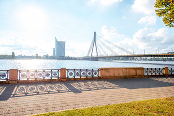 View on the promenade with river and bridge in Riga city, Latvia