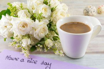 white roses, coffee and have a nice day note