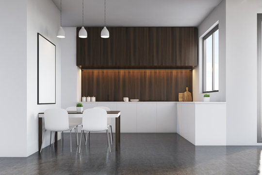 Kitchen with dark wood furniture and poster