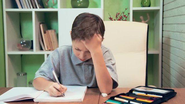 Little boy doing homework at home