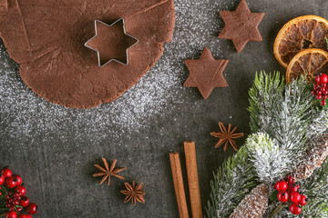christmas baking gingerbread with cutters and ingredients, traditional christmas background from above