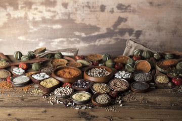 Healthy food and diet theme. Lentils, peas, beans, protein food in bowls, on a wooden table.