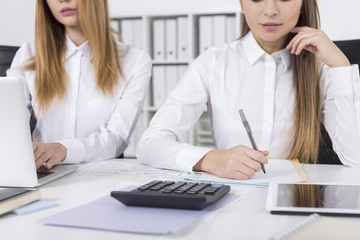 Close up of two girls working in an office