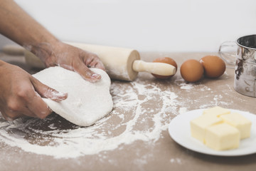 Side view of hands making dough