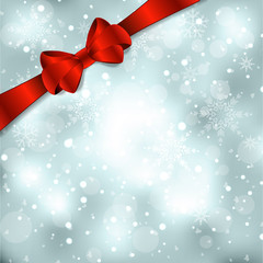 Elegant Christmas background with red bow, ribbon and snowflakes