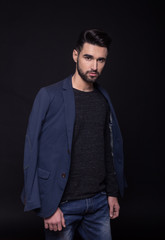 man fashion model, casual clothes, suit. Black background, studi