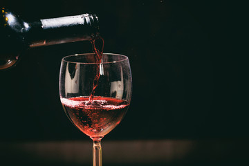 Red wine glass and bottle