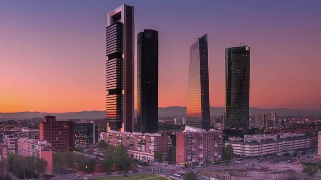 madrid skyline cityscape four towers financial center timelapse from day to night