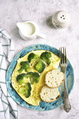 Omelet stuffed with broccoli and cheese.Top view.