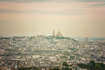 Fototapeta na wymiar Cityscape skyline view of Paris with the dome of Sacre Coeur Church seen from above with a drone onn a sunny day - aerial photography