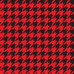 Seamless houndstooth pattern in red and black. Vector image.