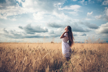 Young girl on wheat field © liandstudio
