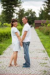 Fototapeta na wymiar Couple in love walking in park