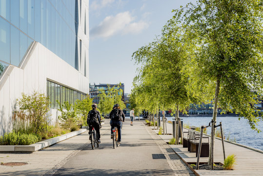 Sweden, Smaland, Jonkoping, People cycling on promenade