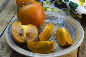 ripe persimmon on a plate