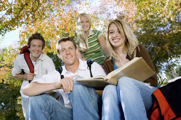 Portrait of young college students studying in campus