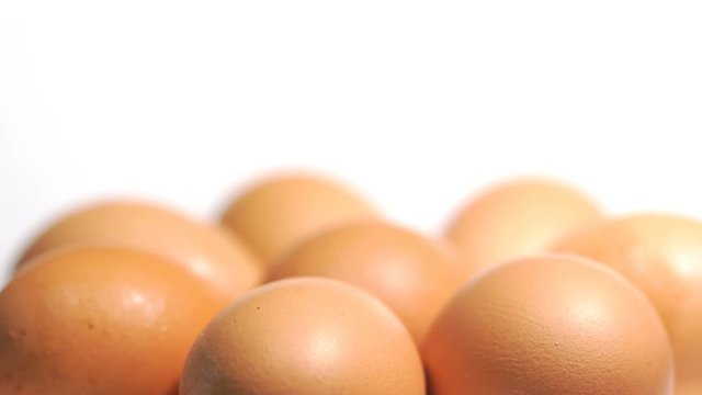 Rotating of egg on white background, Closeup shot
