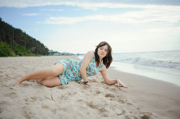 Fototapeta na wymiar Young woman on a beach